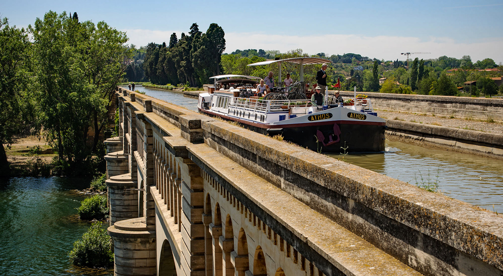 French Hotel Barge Athos crossing the aqueduct over the Orb in the south of France